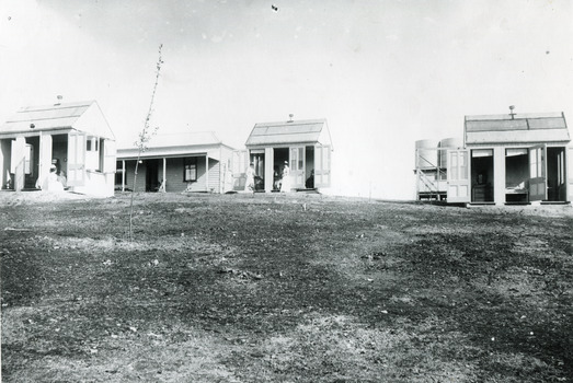 4 early cottages (weatherboard buildings)