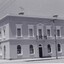 Black and white photo of a two storey building