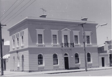 Black and white photo of a two storey building