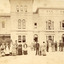 Out front of the Beechworth lunatic mental administration building is twenty-eight staff members divided by gender with females on the left and males on the right. There is a child in the center 