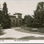 A sand pathway featuring manicured gardens on either side leading towards the Beechworth Mental Asylum administration building 