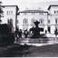 View of the Beechworth Lunatic Mental administration building with fountain in foreground. Three men and a small boy to the left of the fountain.