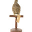 spotted quail standing on a wooden mount facing back