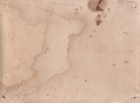 Rear of the aged photograph. Colour is tan with some water stains and dark age spots visible. 