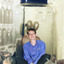 A woman (Beryl) sitting crosslegged in a glass specimen jar, on either side of the jar are the busts of taxidermic Thylacines. This is the photograph used for the invitation to Beryl's Bash.