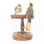 Two eastern spinebills on a stand. Back view.