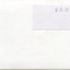 Reverse of photograph with written number stuck on a separate white paper