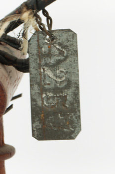 Image of metal-tag, see transcription 