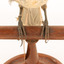 A close-up of the feet of a Grey Butcherbird, standing on a wooden perch