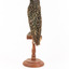 Common Starling standing on a wooden mount facing back
