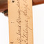 A close-up of a swing-tag (see transcription)