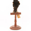 Red-winged Blackbird / Red-winged Starling standing on a wooden mount facing forward 