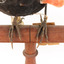Red-winged Blackbird / Red-winged Starling standing on a wooden mount facing forward, close-up of feet