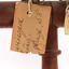 Image of half a swing tag, see transcription 