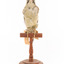 Green woodpecker mounted on wooden perch presenting front. 