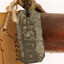 Close up of metal swing tag - see transcript