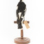 Magpie-Lark/Mudlark standing on wood mount facing back