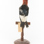 Red Headed Woodpecker standing on wooden mount facing backwards