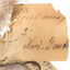 Close-up of a torn swing-tag, see transcription