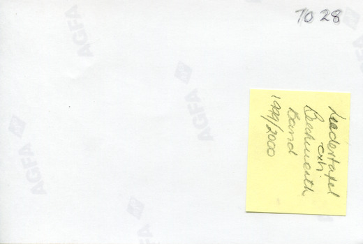 Blank reverse of 7028 with AGFA logo printed diagonally at regular intervals. Yellow label card attached with handwritten English text  (see transcription).
