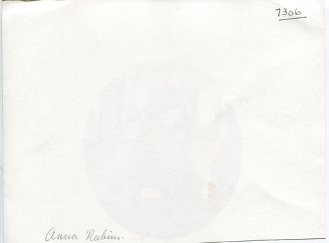 The blank reverse of 7306 with two small pieces of handwritten text in different styles. One is in the top right corner and the other is in the bottom left.
