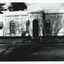 Black and white photograph of the front of the Burke Museum, with a sign out the front.