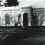 Black and white photograph of the front of the Burke Museum, with a sign out the front.