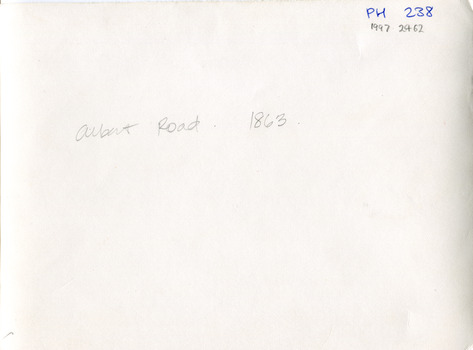 Cream coloured rectangle with writing in pencil and blue pen on the upper half.
