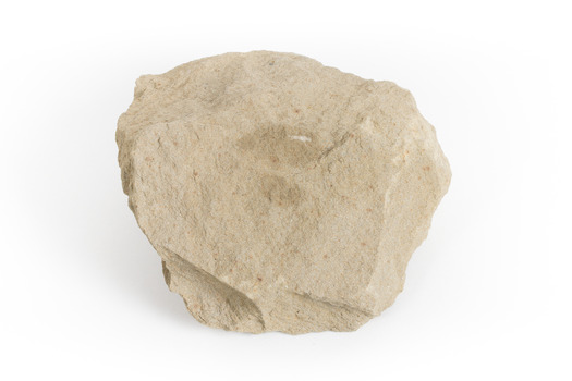 A pale brown/creamy brown coloured rock that is roughly the size of a hand. Sandstone is a sedimentary rock 