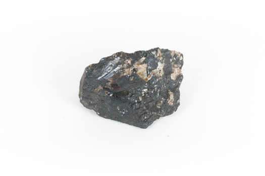 a hand sized solid mineral specimen in black with shades of beige