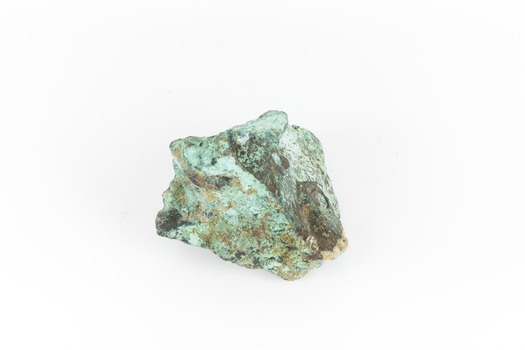 A solid cube-like mineral specimen in shades of green, brown and grey