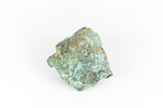 A solid cube-like mineral specimen in shades of green, brown and grey