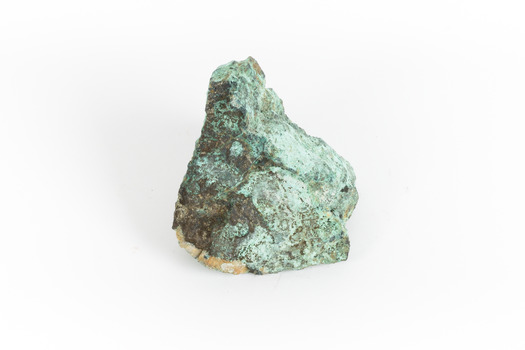 A solid cube-like mineral specimen in shades of green, brown and grey