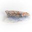 A mineraloid specimen which has a light blue "play-of-colour" in the centre 