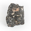 A smaller than hand sized rock specimen which is dark grey in colour with small holes and white deposits across its surface.