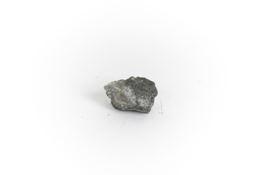 A small gold-sulphide ore mineral specimen in shades of silver and grey with flecks of gold