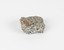 A palm-sized granular quartzose igneous rock in grayish-white tones.
