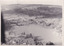 Black and white aerial photograph of a lake and surrounding landscape.