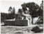Outside fence view of Powder Magazine Beechworth with partial open gate