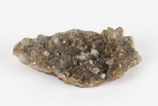 A large hand-sized copper mineral in shades of brown and gray