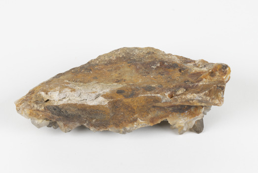 A large hand-sized copper mineral in shades of brown and gray