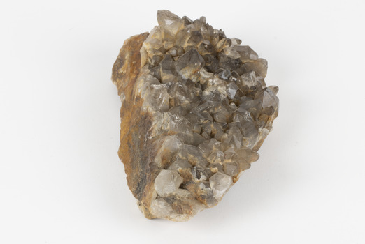 A large hand-sized copper mineral in shades of brown and gray
