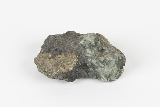 A small-medium-sized solid specimen containing two minerals with shades of brown, black/grey, brassy gold, green, and white