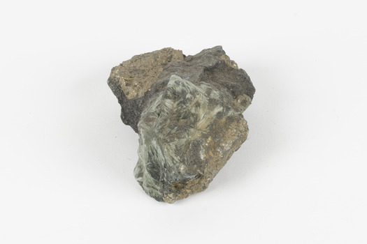 A small-medium-sized solid specimen containing two minerals with shades of brown, brassy gold, green, and white