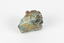 Small mineral specimen in shades of white, green, orange and gray