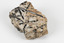 A medium-sized cream and ochre coloured solid mineral specimen with multi-directional black criss-crossing lines. 