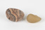 The photograph shows one larger piece of Agate in shades of peach and grey and a smaller piece of orange quartz. 