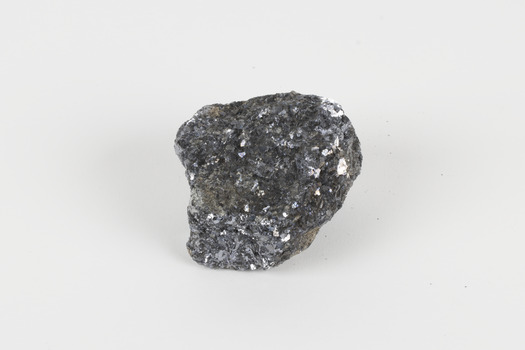 A small-sized solid specimen containing one mineral with a sparkly silver metallic lustre.