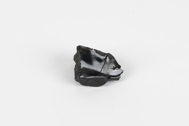 A hand-sized solid specimen containing one mineral with a black/steel-grey shiny metallic lustre.