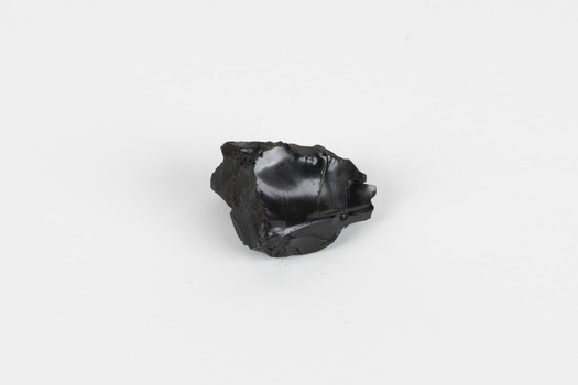 A hand-sized solid specimen containing one mineral with a black/steel-grey shiny metallic lustre.